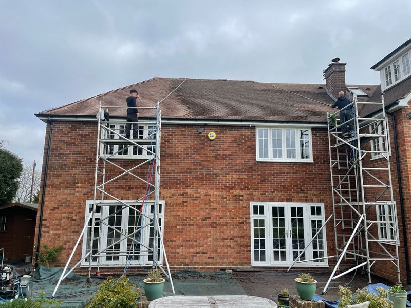 Roof cleaning carried out safely from scaffold towers by The Roof Moss Cleaners in Emsworth